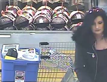 Police look to identify this woman in connection with theft investigation on November 21. (Photo courtesy of CKPS).