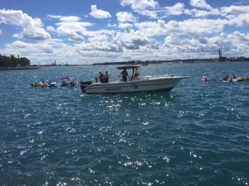 Participants in the Pt. Huron float down are pulled back to U.S. waters after being blown into Sarnia Bay. August 21, 2016 BlackburnNews.com photo by Melanie Irwin.