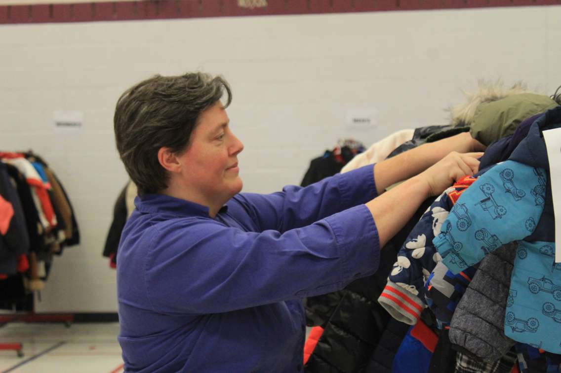 Manager of Community Family Services Nicole Shaw sorts through donated coats at the Salvation Army in Chatham on Wednesday, November 2, 2022. (Millar Hill photo)