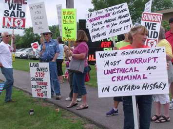OPSEU and anti-wind turbine groups greet Ontario's premier with harshly worded signs and chanting June 18, 2015 (BlackburnNews.com Photo by Briana Carnegie)