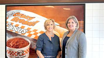 Little Caesars Pizza franchise owner Kathleen Mundy stands by Ontario's NDP leader Andrea Horwath at the Lambton Mall Rd. location. August 5, 2015 (BlackburnNews.com Photo by Briana Carnegie)