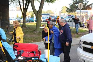Residents evacuate after a fire at an apartment building on Rivard Ave. in Windsor, October 7, 2015.  (Photo by Adelle Loiselle)