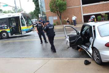 A car and a Transit Windsor bus collide at the intersection of Erie and Goyeau, August 10, 2015. (Photo by Jason Viau)
