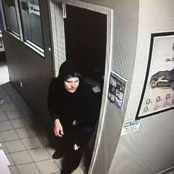 Police are looking to identify this man in connection with a break-in at a business on St. Clair Street in Chatham. (Photo courtesy of Chatham-Kent police)