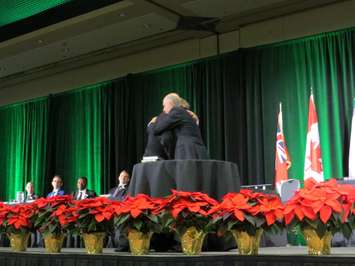 Mayor Ed Holder and Glen Pearson embrace after the investiture of the mayor's chain of office, December 3, 2018. (Photo by Miranda Chant, Blackburn News)