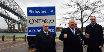 Premier Doug Ford speaks to a crowd in Point Edward after unveiling his first 