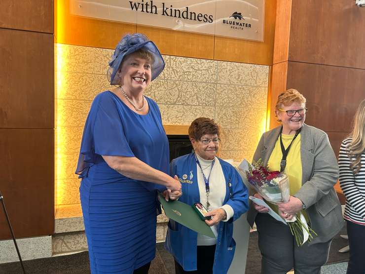 Sarnia-Lambton MP Marilyn Gladu (left) and Lynn LeFaive (right) of the Volunteer Coordinators' Association of Sarnia-Lambton present Mary Anderson with a King Charles III Coronation Medal. February 27, 2025 at Bluewater Health. Blackburn Media photo by Lindsay Newman.