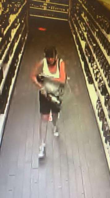 Chatham-Kent police are looking for this woman in connection with a theft investigation at the LCBO on Wellington Street in Chatham. (Photo courtesy of Chatham-Kent police)