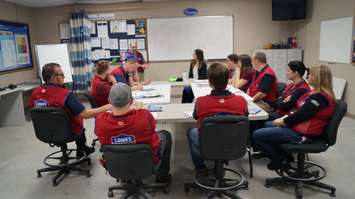 Laura Stokley of Community Living met with Lowe's employees to discuss an upcoming fundraiser to build a backyard sanctuary for one of its clients. March 7, 2016 (BlackburnNews.com Photo by Briana Carnegie)