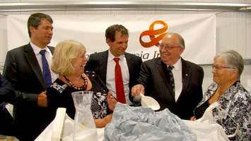 MPP Bob Bailey holds up succinic acid at BioAmber Sarnia plant August 6, 2015 (BlackburnNews.com Photo by Briana Carnegie)
