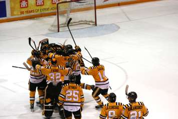 The Sting celebrates a big 7-6 SO win over the Greyhounds Dec 7, 2014 (BlackburnNews.com photo by Dave Dentinger)
