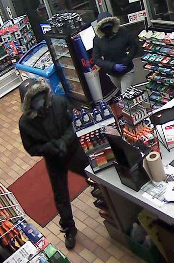 Windsor police are looking for help in identifying these two suspects following multiple convenience store robberies. (Photo courtesy of the Windsor Police Service)