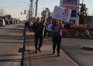 Member of CUPE and supporters rally outside MPP Andrew Dowie's officer in Windsor, November 4, 2022. (Photo by Maureen Revait) 