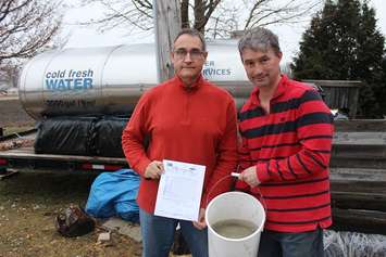 Water Wells First spokesperson Kevin Jakubec posing with Paul Brooks at 9597 Brook Line. January 23, 2018. (Photo by Sarah Cowan Blackburn News Chatham-Kent). 