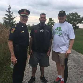 James Godden (centre) of the Soldiers of Odin, is flanked by Windsor Police Chief Al Frederick and Mayor Drew Dilkens on October 15, 2017. Photo courtesy James Godden/Facebook