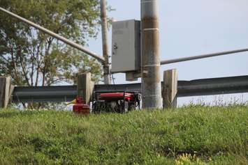 A generator supplies power to traffic lights at the intersection of the EC Row Expressway and Central Avenue after a tornado ripped through the area on August 24, 2016. (Photo by Ricardo Veneza)