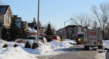 Windsor police and fire attend the scene of a fire in the 4200-block of Barton Cres. , February 23, 2015. (Photo by Mike Vlasveld)