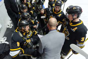 Sarnia Sting head coach Alan Letang speaking with him players on the bench.  1 May 2022.  (Metcalfe Photography)