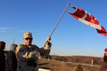 US Air Fore veteran Louis Devore is among the supporters at the Communications Rd. overpass on Hwy. 401 for the repatriation ceremony of fallen veteran and Wheatley native John Gallagher on November 20, 2015. (Photo by Ricardo Veneza)