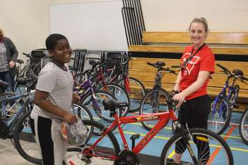 Samuel Sainternie, a grade-five student at Begley Public School in Windsor, looks for a bike on June 21, 2019. Photo by Mark Brown/Blackburn News.