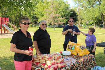 Volunteers from ALSO set up a barbecue at a special event at Farrow Riverside Miracle Park in Windsor, August 7, 2019. Photo by Mark Brown/Blackburn News.