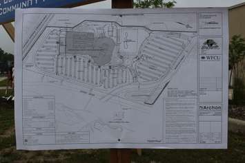 New WFCU Centre blue prints are displayed at the ground breaking ceremony for a new community pool to be added onto the original structure, July 7, 2015. (Photo by Mike Vlasveld)