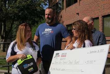 Andrew Stoddart's mother Cara and aunt Christa with Dad Club London President Jeremy McCall at the TVDSB office on Dundas St., September 26, 2017. (Photo by Miranda Chant, Blackburn News)