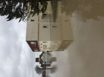 Duane Desrosiers cleaning up his flooded building at 65 Thames St. in Chatham. (Photo by Paul Pedro)