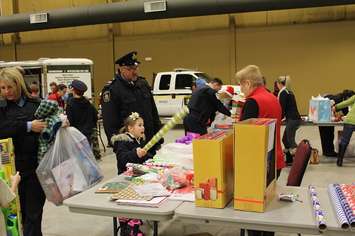Gift wrapping at the John D. Bradley Convention Centre. December 17, 2016. Photo by Natalia Vega)