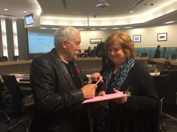 Essex Mayor Ron McDermott (L) in Council Chambers at the Essex Civic Centre on November 5, 2014 signing a petition handed out by Kingsville Deputy Mayor Tamara Stomp (R) opposing the pending closure of the obstetrics ward at Leamington District Memorial Hospital. (Photo by Ricardo Veneza)