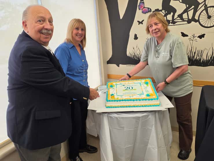 Sarnia-Lambton MPP Bob Bailey, Donna Morreau and Lynn Laidler cut the cake to celebrate 20 years for the Rapids Family Health Team - Sept. 16/26 (Blackburn Media photo by Josh Boyce)
