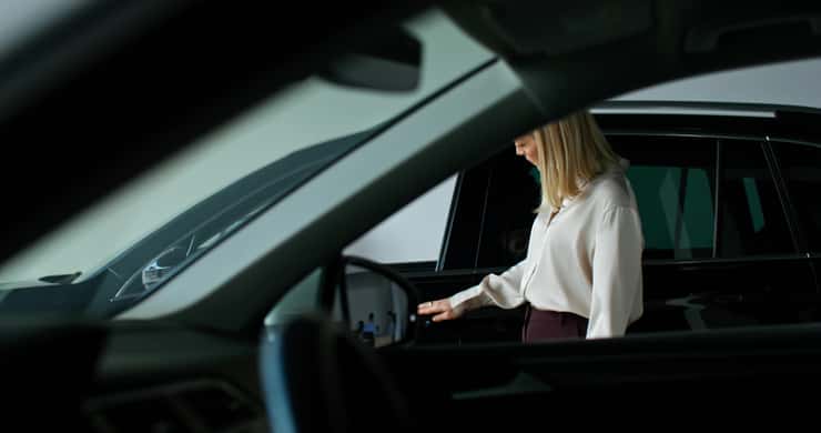 (Photo of a woman shopping for a vehicle courtesy of M-ART Production / Royalty-free / iStock / Getty Images Plus)