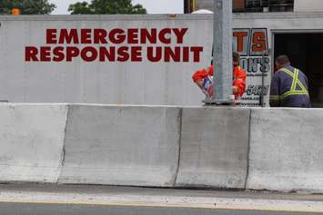 Two transport trucks collide in the eastbound lanes of Hwy. 401 just west of the Dougall overpass, June 18, 2015. (Photo by Jason Viau)