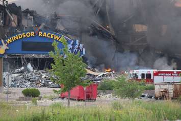 Fire crews continue to fight a fire at Windsor Raceway July 1, 2015. (Photo by Adelle Loiselle)