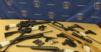 Multiple guns and weapons seized from a north London home, November 28, 2023. Photo provided by London police.