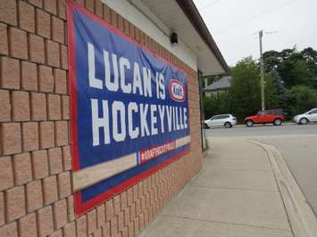 A banner on the side of the Lucan Community Memorial Centre. (Photo by Miranda Chant, Blackburn News)