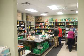 Food being prepared and organized at the Outreach for Hunger in its kitchen. October 9, 2018. (Photo by Greg Higgins)