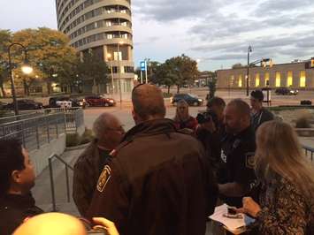Sarnia Police escort a man out of Sarnia City Hall. Monday, October 24, 2016. BlackburnNews.com photo by Melanie Irwin