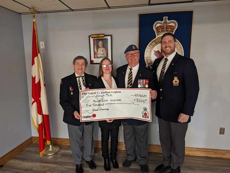 Ladies' Auxiliary President Mary Ann Buuntrock, River City Vineyard's Sarah Abraham, Community Services Officer Bruce Browning and Legion President Ron Realesmith. February 23, 2024 (Image courtesy of Sarnia Legion Branch 62 via. Facebook.)