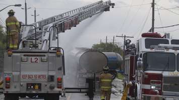 Firefighters spraying two haulers during the 2019 Sarnia Area Disaster Simulation. May 22, 2019. (Photo by Colin Gowdy, BlackburnNews)