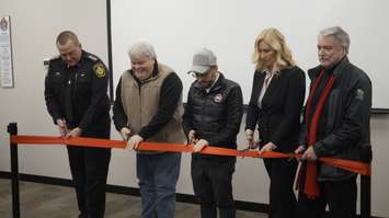 Sarnia Police Chief Norm Hansen (far left) and Sarnia Mayor Mike Bradley (far right), joined by representatives of Aamjiwnaang and Europro, to cut the ribbon officially opening the new training centre at Lambton Mall. January 16, 2020 Photo by Melanie Irwin