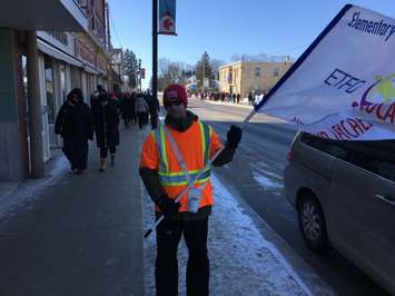 ETFO member Darrell Uhler (holding flag) says the issue of special education cuts and less support for students is a major issue for the union in their battle with the provincial government. He is pictured here at the picket rally in Blyth in front of Huron-Bruce MPP Lisa Thompson's office in Blyth. February 21st, 2020 (Photo by Ryan Drury)