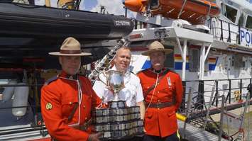 The Memorial Cup is loaded on the Canadian Coast Guard Ship Constable Carriere to travel to the Memorial Cup host city of Windsor.  May 18, 2017 (Photo by Melanie Irwin)