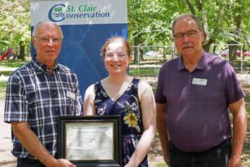 Madeline Morrison is awarded with the Tony Stranak Conservation Scholarship by St. Clair Region Conservation Authority Vice-Chair, Larry Gordon (left) and Chair, Joe Faas (right).