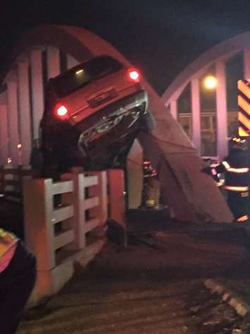 A vehicle collides with the River Canard bridge in Amherstburg, December 6, 2015. (Photo courtesy  @JPed024/Twitter)