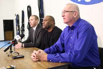 (left to right) Manager of Sales for the Windsor Express Dylan Cullis, Windsor City Councillor John Elliott, and Director of Security and Government Relations Canada for the Ambassador Bridge Company Stan Korosec speak to the media at the Sandwich Teen Action Group, March 27, 2015. (Photo by Mike Vlasveld)