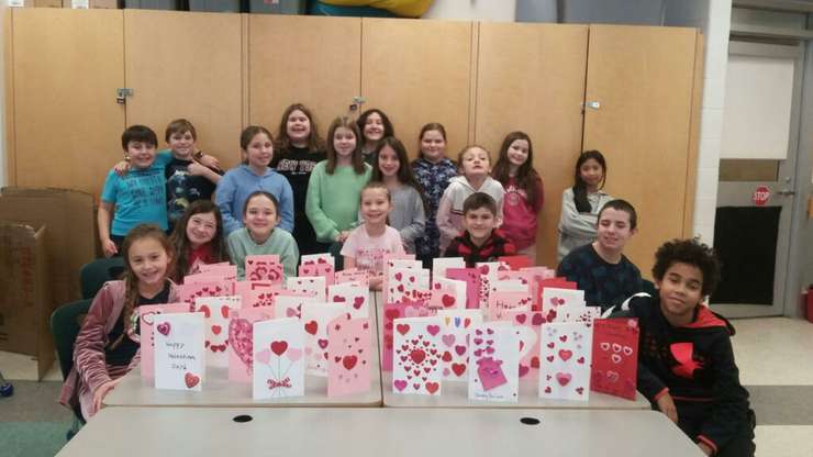 Students at Holy Trinity Catholic School in Sarnia show off the Valentine's Day cards they made for local seniors. February, 2024. (Photo courtesy of newsdesk.st-clair.net) 