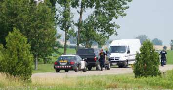 Police on scene outside a home on Arkona Rd where a woman's body was found July 13th 2014. (BlackburnNews.com photo by Jake Jeffrey)