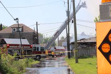 Facing south from an alley off Assumption St. as firefighters battle the fire on Wyandotte St. E in Windsor, May 23, 2016.  (Photo by Adelle Loiselle)