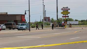 Windsor police investigating a shooting at Wyandotte St. E near Walker Rd. June 22, 2016. (Photo by Maureen Revait)